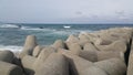 Close view of tetrapod stones on the sea shore to prevent coastal ersosion Royalty Free Stock Photo