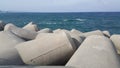 Close view of tetrapod stones on the sea shore to prevent coastal ersosion Royalty Free Stock Photo