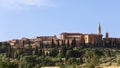 Close view to a Tuscan hill with medieval Pienza town on top. Val d`Orcia, Italy Royalty Free Stock Photo