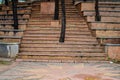 trees growing on the steps of a city park.