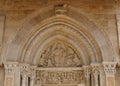 the tympanum above the entrance door of the Saint-Hilaire Collegiate Church in Semur-en-Brionnais