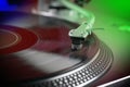 Close view of a vinyl record playing on a turntable