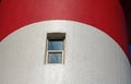 WINDOW IN A RED AND WHITE LIGHTHOUSE