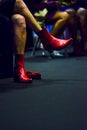 Close view of a woman wearing a red boots at Momad 2023 Madrid Spain