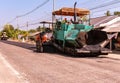 Close view on the workers and the asphalting machines, Workers making asphalt at road construction Royalty Free Stock Photo