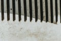 Close view of a worn comb showing unique texture and shadows on a textured surface Generative AI Royalty Free Stock Photo