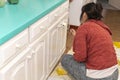 Young woman painting furniture at home Royalty Free Stock Photo