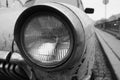 Close wide low angle view of an old soviet vintage muscle car headlight