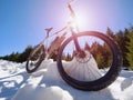Close wide view to bike stays in snow. Winter snowy mountains