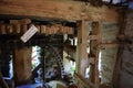 A close up of a wooden and metal made wheel in a mill