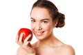 Closeap of a smiling woman with red apple in hand