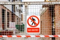 Closed access door to the construction site of a building, with a no-entry sign Royalty Free Stock Photo