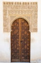 Closed Arabic-style door in the Nasrid palaces of the Alhambra complex in Granada, Spain Royalty Free Stock Photo