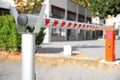 Closed automatic boom barrier on sunny day outdoors, closeup