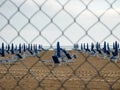 Closed beach parasol at empty seaside coast. Beach in Italy