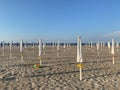 Closed beach umbrellas on a beach