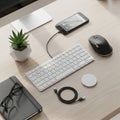 On a closed black notebook. A white charging pad and extra USB cable Royalty Free Stock Photo