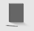 Closed blank black cover hardcover notebook with pen on the desk vector template