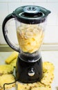 Blender ready for making pineapple banana smoothie