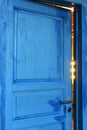 Closed blue door in bright room Royalty Free Stock Photo