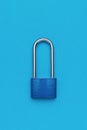 Closed blue metal lock on a blue background Royalty Free Stock Photo