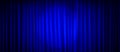 Closed blue theater stage curtain with spotlight. Royalty Free Stock Photo
