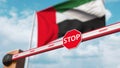 Closed boom barrier with stop sign against the UAE flag. Restricted border crossing or certain ban. 3D rendering