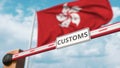 Closed boom gate with CUSTOMS sign on the flag background. Border closure or protective tariffs in Hong Kong. 3D