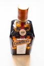 Closed bottle of french Cointreau liqueur on table