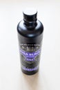 Closed bottle of Riga Black Balsam on pale table