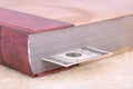 Closed brown book with a bookmark 100 USD Royalty Free Stock Photo