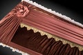 Closed brown coffin covered with elegant cloth on gray background. coffin close-up with gold flowers.