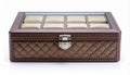 Closed Brown Quilted Watch Box with Latch on White Background Royalty Free Stock Photo