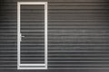 Closed brown roller shutter door, gates to the garage. security in a modern building Royalty Free Stock Photo