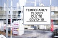 Closed building site sign due to Coronavirus Covid-19 Royalty Free Stock Photo