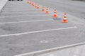 Closed car parking lot with white mark and traffic cone on street used warning sign on road