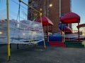 Closed children`s playground in the city. empty playground during the quarantine coronavirus. kids playground wrapped with red-an Royalty Free Stock Photo