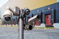 Closed circuit camera Multi-angle CCTV system against the background of a modern warehouse complex