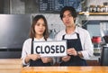 Closed coffee shop A young couple man and female overturned a label to close they business because of loss in selling coffee