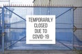 Closed construction site sign due to Coronavirus Covid-19 Royalty Free Stock Photo