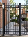 Closed courtyard of a residential building with an electronic code lock on the fence Royalty Free Stock Photo