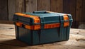 Closed Dark Green and Orange Plastic Toolbox on a Rustic Wooden Surface Keywords: toolbox, tool box, storage Royalty Free Stock Photo