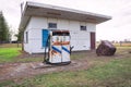 Closed and derelict service station with petrol pumps