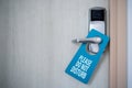 Closed door of hotel room with please do not disturb sign. Hotel Door Hanger Tags Mockup