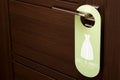 closed door with a sign on the handle Dress to impress Do not disturb Royalty Free Stock Photo