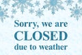 Closed due to weather sign with blue snowflake frame Royalty Free Stock Photo