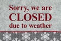 Closed due to weather sign gray and white snowflake border on gray felt material Royalty Free Stock Photo