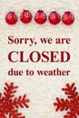 Closed due to weather sign with red snowflakes ornaments on beige sherpa Royalty Free Stock Photo