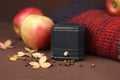 Closed elegant navy blue engagement ring box, red knitted sweater, dry hydrangea flowers and apples on brown background. St Royalty Free Stock Photo