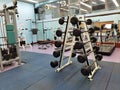 3 11 2021 closed and empty sport center with Modern light gym, equipment, Barbells of different weight on rack in university of